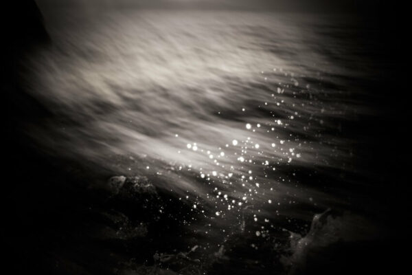 A powerful image from Davide Esposito's "Archetypes" project, capturing the essence of water, rocks, and sky in a symbolic dance.