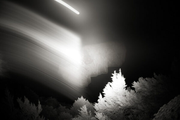 An awe-inspiring composition from Davide Esposito's "Archetypes," featuring the moon, rocks, and the mighty presence of Capri.