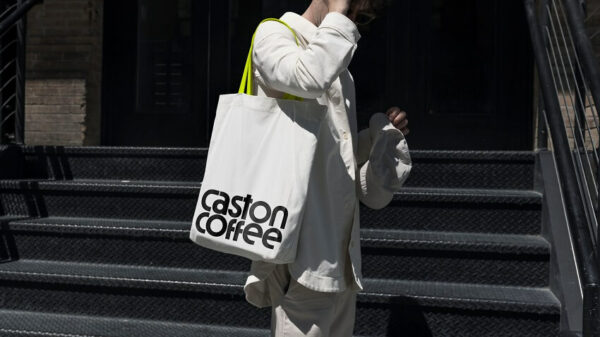 Experience how Yihuang Zhou's distinctive branding transforms onto a stylish tote bag for Caston Coffee Roasters.