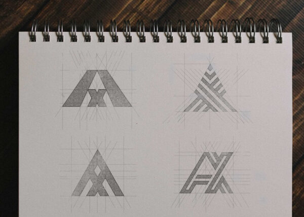 Atraxo Logo Concepts - Sketches on paper, capturing the essence of connectivity and precision