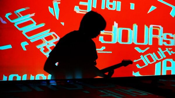 88rising Rebrand cover featuring a shadowy guitarist against a vibrant background with rebranded colors and fonts.