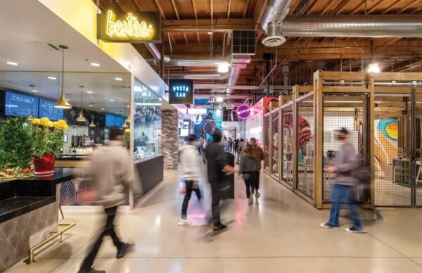 Hallway inside Rodeo 39 with signage and logos for various dining venues