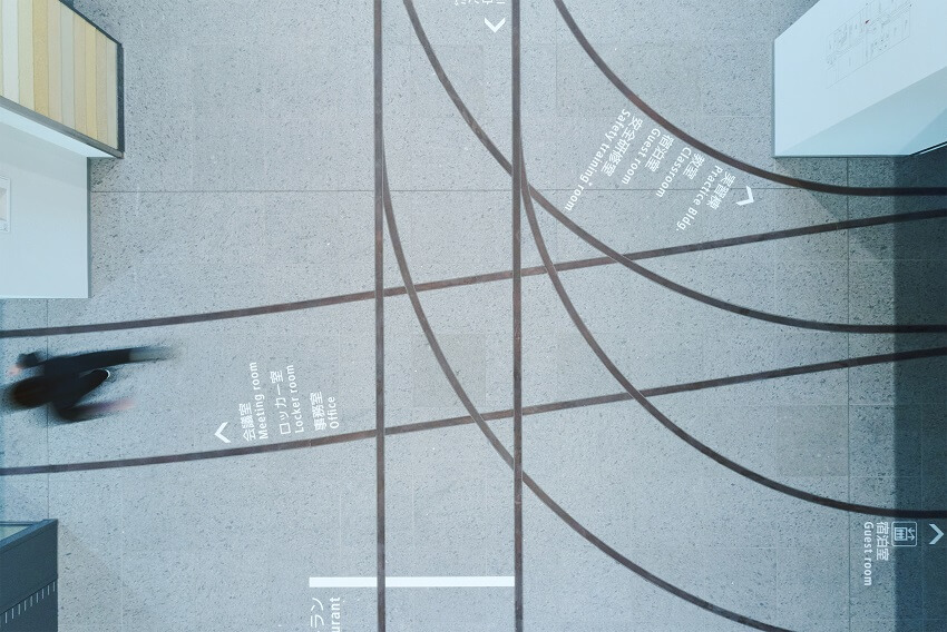 Intricate functional typography on the floor at Totetsu Training Institute