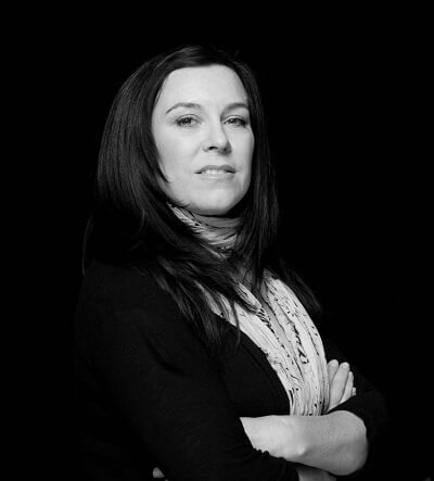 Robin Milgrim, C2A Juror, exuding confidence and creativity in a captivating portrait.