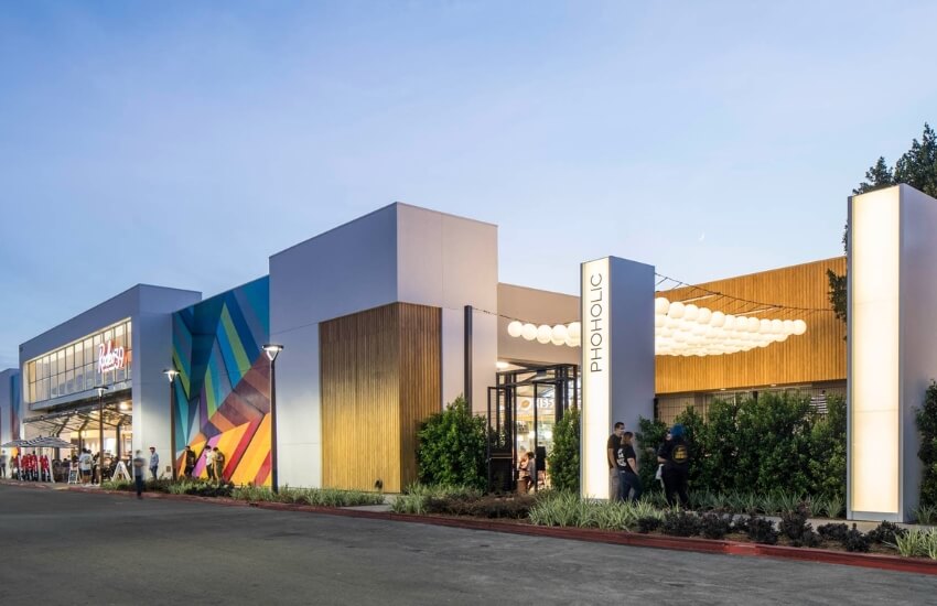 Exterior of Rodeo 39 bar displaying large-scale murals and bold functional typography